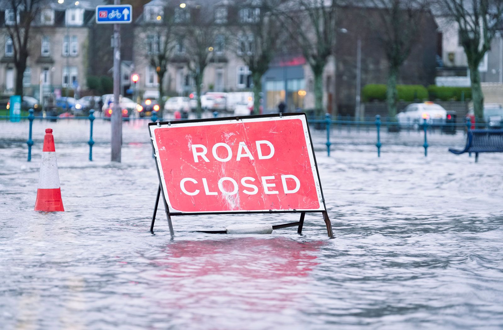 flooded road with road closed sign banner image